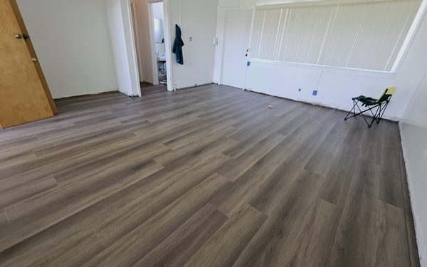 Empty classroom with a new luxury vinyl plank floor laid wall to wall